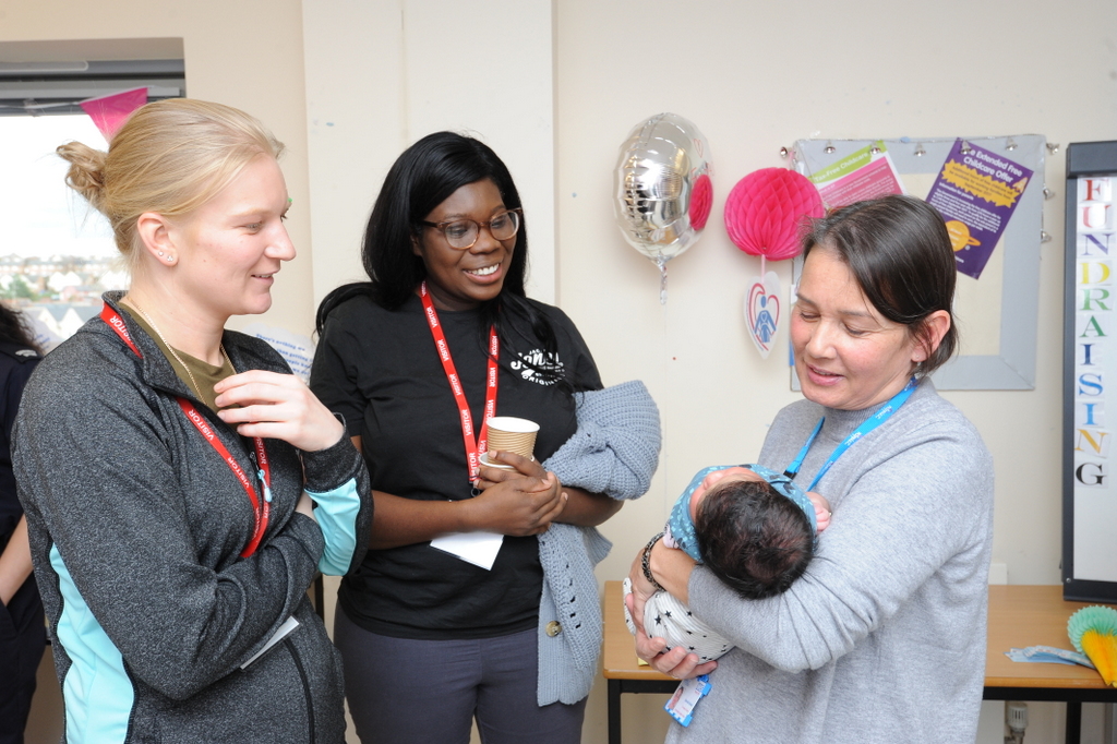 Mother and baby at community parent programme meeting